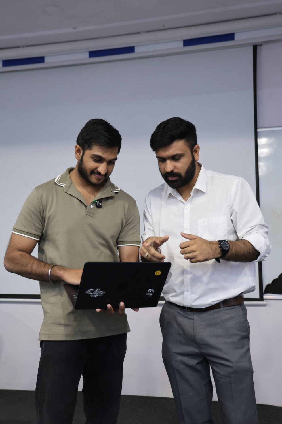 Digital Nest team member helping a recruiter finalise a hire on a laptop